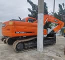2019 Doosan DX225LC crawler excavator, rear three-quarter view