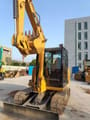 2024 Caterpillar 305.5E2 mini excavator, front three-quarter view