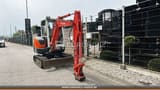 2010 Kubota KX91-2 S2 mini excavator, front three-quarter view