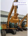 2025 Caterpillar 320GX crawler excavator, front three-quarter view