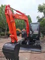 2024 Hitachi ZX70-5G mini excavator, front three-quarter view