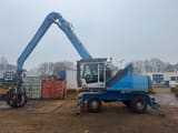 2011 Fuchs MHL335 material handler, side view