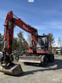 1997 O&K MH CITY wheeled excavator, front three-quarter view