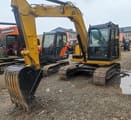 Caterpillar 307E mini excavator, front three-quarter view
