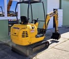 2002 Komatsu PC12R-8 mini excavator, rear three-quarter view