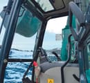 2024 Sunward SWE155F Crawler Excavator cab interior, showing the seat and control levers from a wide angle.