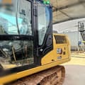 2024 Caterpillar 313GC crawler excavator cab and side view