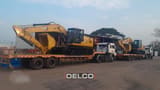 2026 Caterpillar 324 crawler excavator on a flatbed trailer, side view