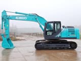 2025 Kobelco SK220XDLC-10 Crawler Excavator with a teal body and a prominent digging bucket at the end of the arm.