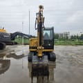 2022 Caterpillar 305.5E2 mini excavator, front view