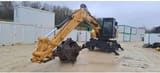 2021 Caterpillar MH3022-07 wheel excavator, front three-quarter view