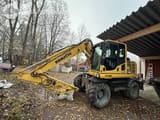 2014 Komatsu PW148-8 wheel excavator side view