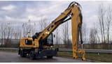 2020 Caterpillar MH3024-1 wheel excavator side view