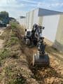 2017 Schaeff TW95 wheel excavator, front-quarter view