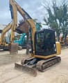 Caterpillar 305.5E mini excavator, front three-quarter view