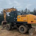 Hyundai Robex 210W-7 wheel excavator, rear three-quarter view