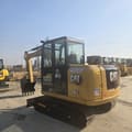 2024 Caterpillar 305.5 mini excavator, rear three-quarter view