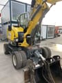 2023 Wacker Neuson EW65 wheel excavator, front three-quarter view