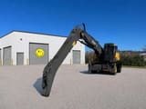 2021 Volvo EW240EMH material handler, rear three-quarter view