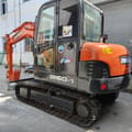 Doosan DH60-7 mini excavator, rear three-quarter view