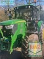 2017 John Deere 6115 M tractor, front three-quarter view