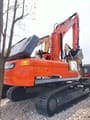 2022 Doosan DX300LC crawler excavator, rear three-quarter view