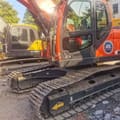 2022 Doosan DX225 crawler excavator, side profile view