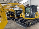 2023 Komatsu PC70 mini excavator, front three-quarter view