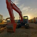 2023 Hitachi ZX210 crawler excavator, front three-quarter view