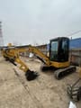 2023 Caterpillar 303.5ECR mini excavator, side profile view