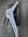 2026 Bobcat E16 Mini Excavator boom arm, painted light gray, with visible pivot points and mounting holes.