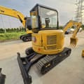 2024 Caterpillar 303.5E mini excavator rear three-quarter view