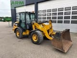 2015 Caterpillar 906M wheel loader, front three-quarter view