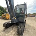 2024 Volvo EC55D mini excavator, rear three-quarter view