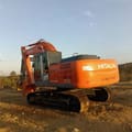 2023 Hitachi Zaxis 210 crawler excavator, rear three-quarter view