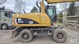 2010 Caterpillar M318D wheel excavator side view