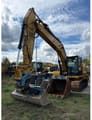 2022 Caterpillar 320GC crawler excavator, front three-quarter view