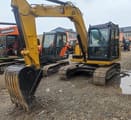 Caterpillar 307E mini excavator, front three-quarter view