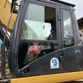 Caterpillar 329D crawler excavator cab side view
