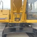 Caterpillar 330BL crawler excavator, close-up of boom base and cab