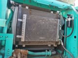 Kobelco SK210 crawler excavator engine compartment radiator view