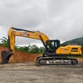 2026 XCMG XE335G Crawler Excavator with its full boom and arm extended forward, showing the digging bucket.