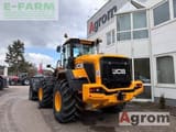 2025 JCB 427HT AGRI wheel loader, front three-quarter view