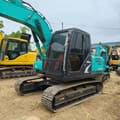 2022 Kobelco SK140 crawler excavator, front three-quarter view