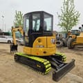2023 Caterpillar 303.5E2 mini excavator, rear three-quarter view