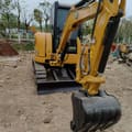 2023 Caterpillar 303.5E mini excavator, front three-quarter view