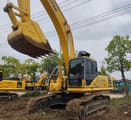 Komatsu PC350 crawler excavator, side view with raised bucket