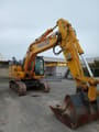 2022 Komatsu PC210 NLC-11 excavator, front three-quarter view