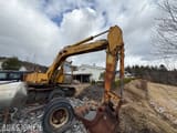 1985 Mitsubishi MS120-2 excavator side view