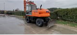 2002 New Holland EX165W wheel excavator, rear three-quarter view